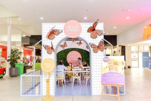 Kids painting in a recreational area made of reboard inside the Smithfield Shopping Centre.